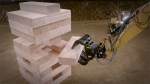 Construction Machines Play Jenga With 600-Pound Blocks
