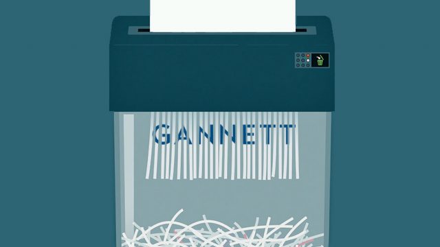 A paper shredder shows a piece of paper with the word GANNETT being shredded