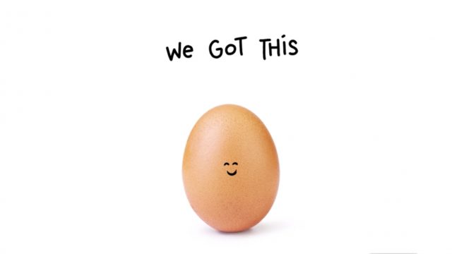 An egg with eyes and a smile drawn on its shell with the text 