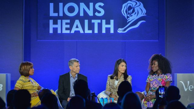 four marketers are seen talking on a stage at an event that says Lions Health at Cannes