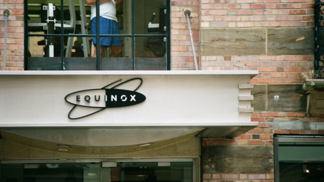 facade signage of an equinox fitness location with equinox logo