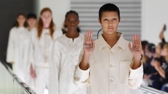 gucci milan fashion week runway protest straitjacket mental health