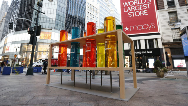 Colorful liquid in giant test tubes are on display in New York's Herald Square