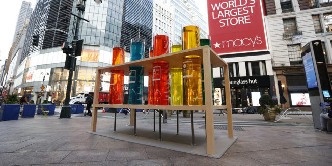 Colorful liquid in giant test tubes are on display in New York's Herald Square