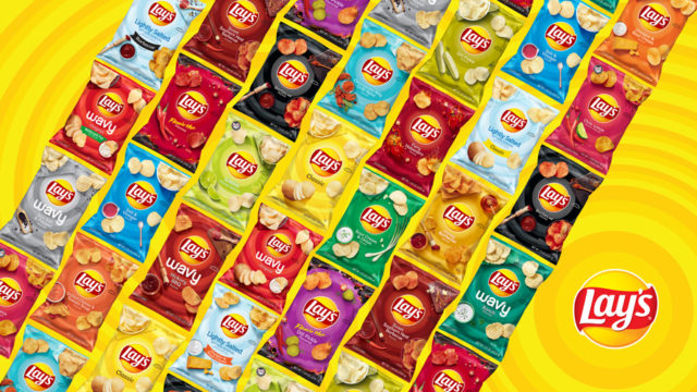 Multiple bags of Lay's potato chips in various flavors