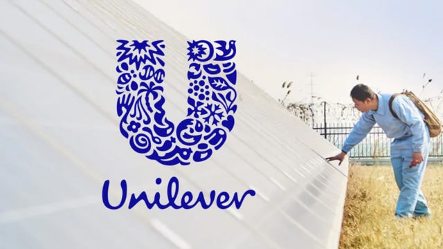 Unilever logo with man touching solar panels