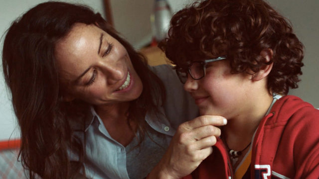 A mother comforts her son in Gap holiday ad.