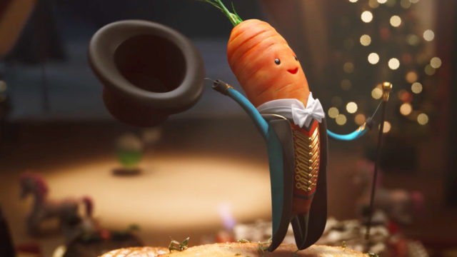 A carrot dressed as a circus announcer holds out a top hat
