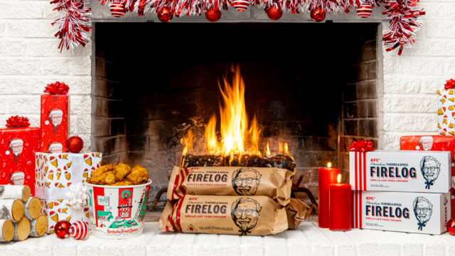 KFC fried chicken scented firelogs sit in front of a festive fireplace