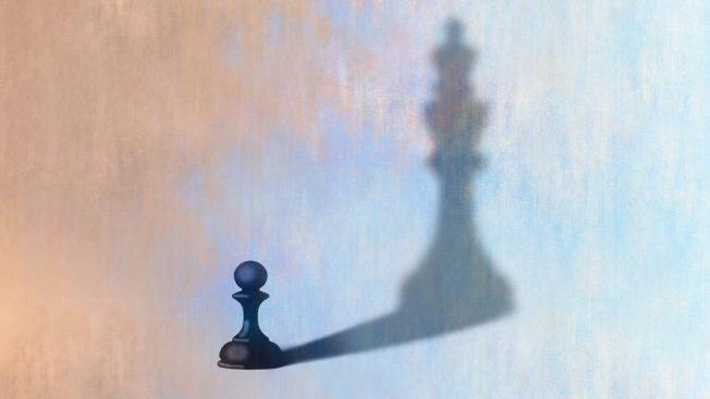 A pawn with a shadow of a king