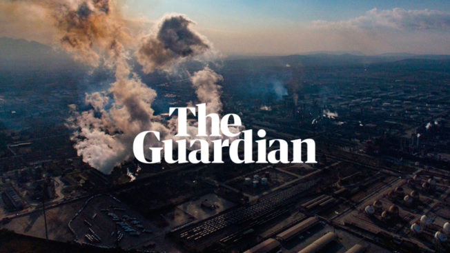 the guardian logo over an oil refinery