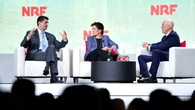 paul ryan, left, on stage at the national retail federation's conference