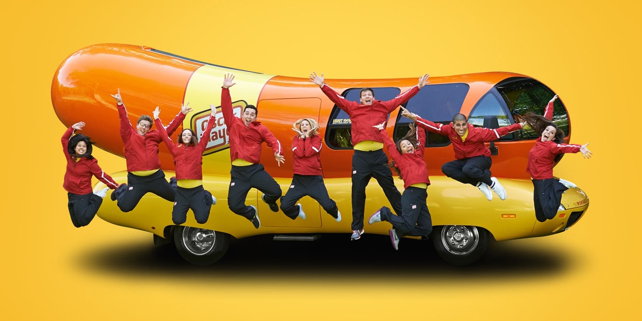 Oscar Mayer Wienermobile and people jumping