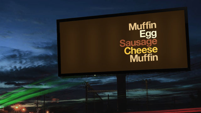 An outdoor ad lists the ingredients of an Egg McMuffin without naming the sandwich