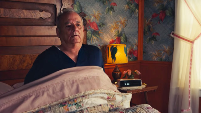 bill murray laying in bed looking like he suddenly woke up