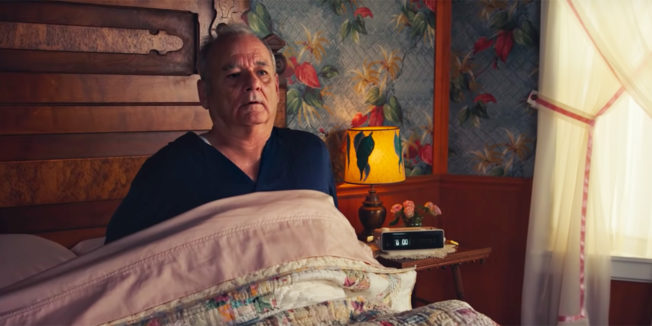 bill murray laying in bed looking like he suddenly woke up