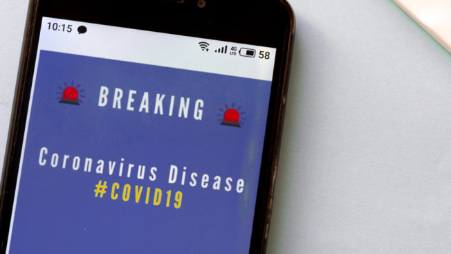 a phone showing a coronavirus alert