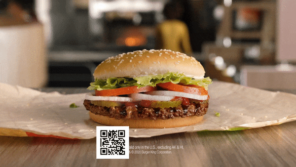 A moving QR code next to a Whopper