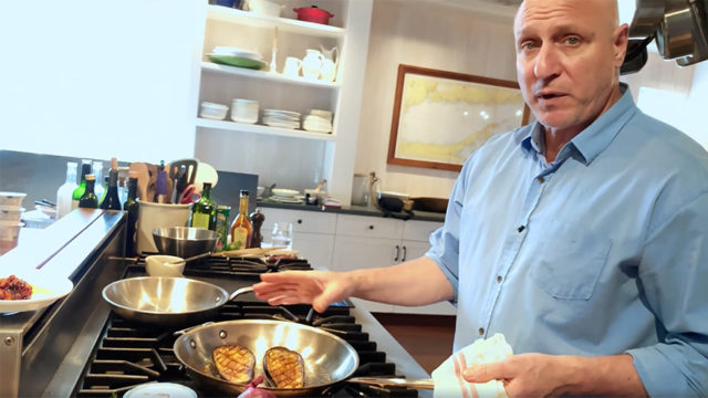 Celebrity chef Tom Colicchio cooking in kitchen