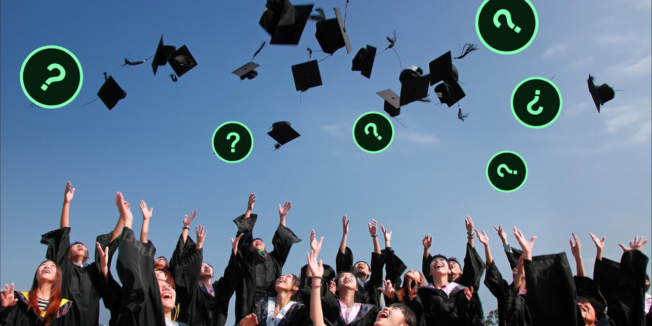 People throwing up graduation caps with question marks in the air as well