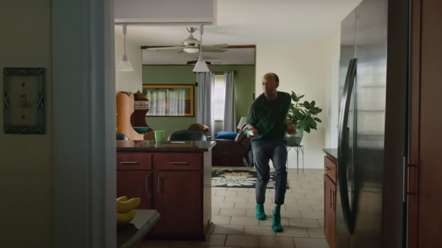 a man dancing in his kitchen