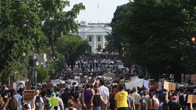 protesters marching toward the white house