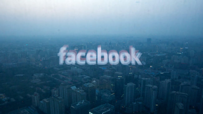 facebook logo over a city landscape
