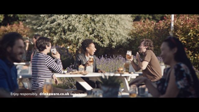 Friends sat in pub garden