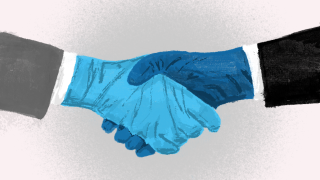 two gloves hands shaking hands