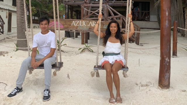 Cecilia Pagkalinawan and her son on swings