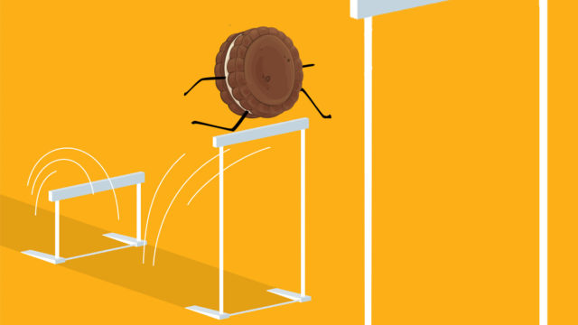 an oreo cookie jumping over a hurdle on an orange background