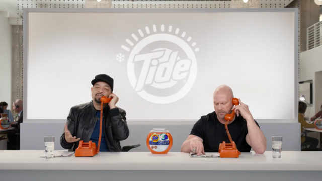 ice-t and stone cold steve austin calling people while surrounded my tide-themed merch