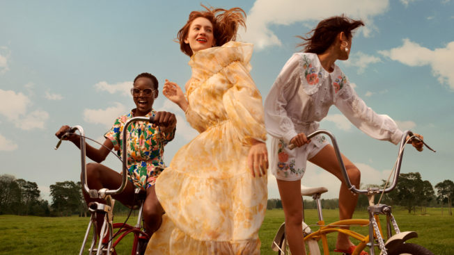 Four models cycle through the countryside