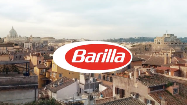 pasta brand barilla logo with a town as a background