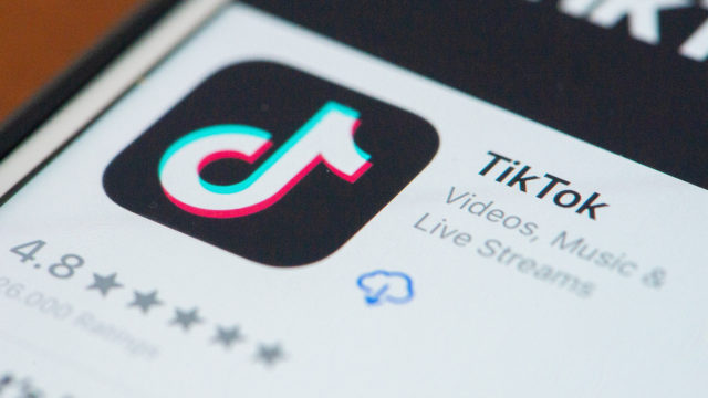 A screen on a smartphone shows the TikTok app in the app store
