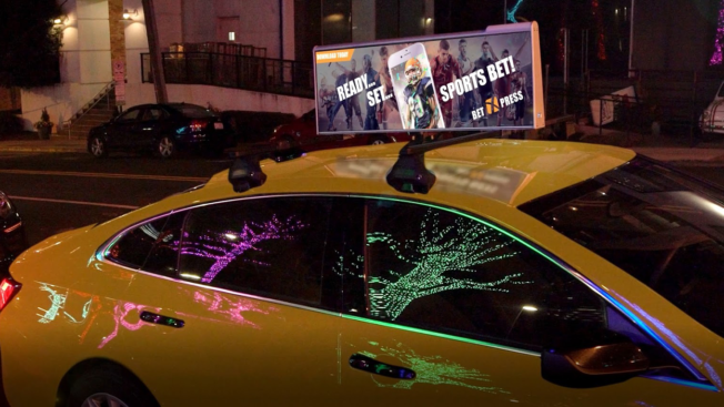 Uber screens will adorn yellow cabs in NYC.
