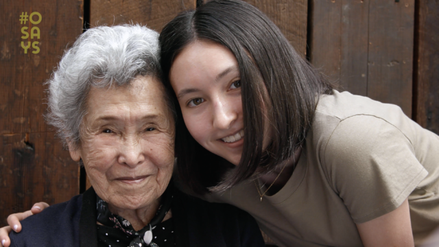 An older woman and younger woman embracing and smiling