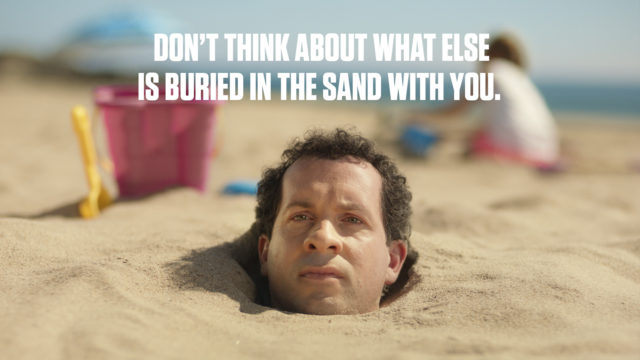 Man buried in the sand