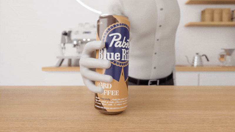 A computer animation shows a coffee shop erupting into cans of Pabst Hard Coffee