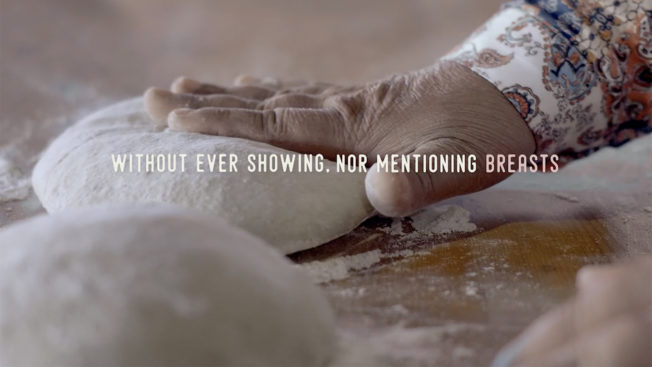 A hand kneading bread dough with the caption, 