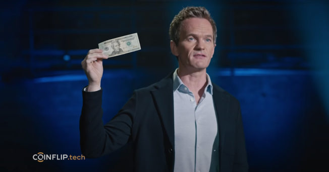 Neil Patrick Harris holds up a note
