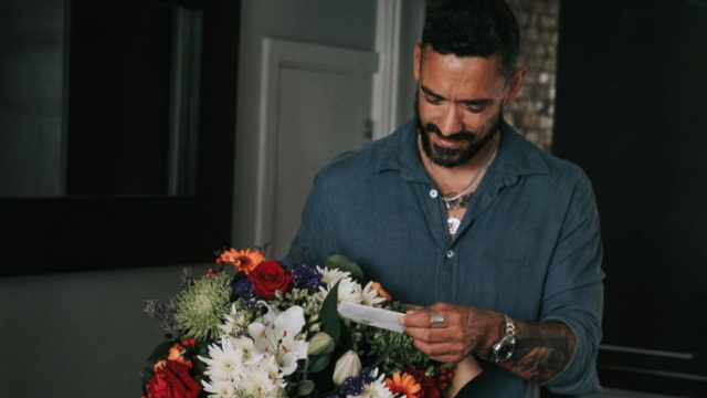 man receiving flowers