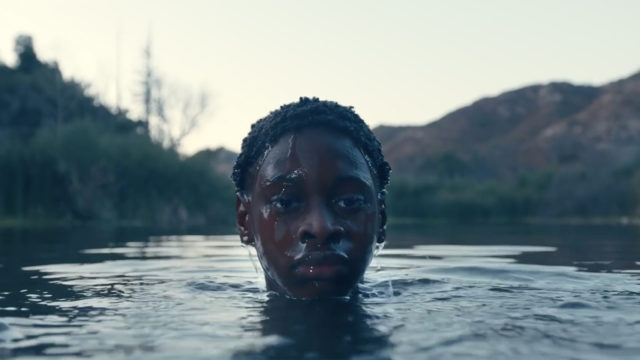 A young boy rises out of a lake in the You Love Me ad