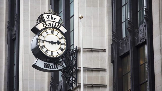 A clock is shown outside the Daily Mail office