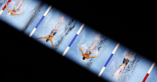 Bird's eye view on swimmers and view is obstructed.
