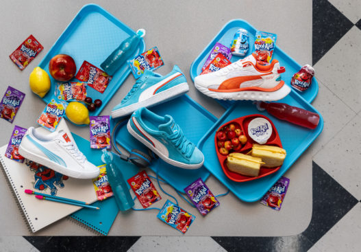Shoes among a colorful school lunch