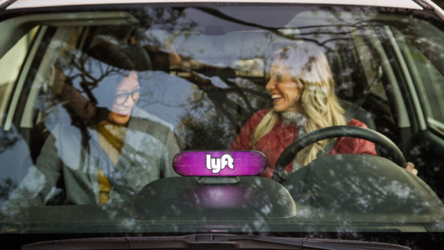 Two women driving in a Lyft vehicle