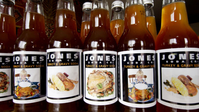 Bottles of Jones Soda Turkey and Gravy flavor are lined up next to each other