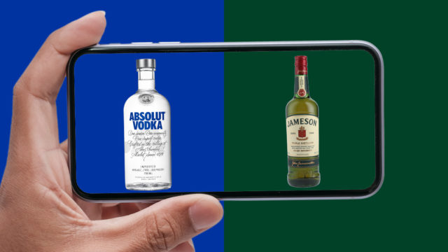 a bottle of vodka and whisky side by side on a smartphone
