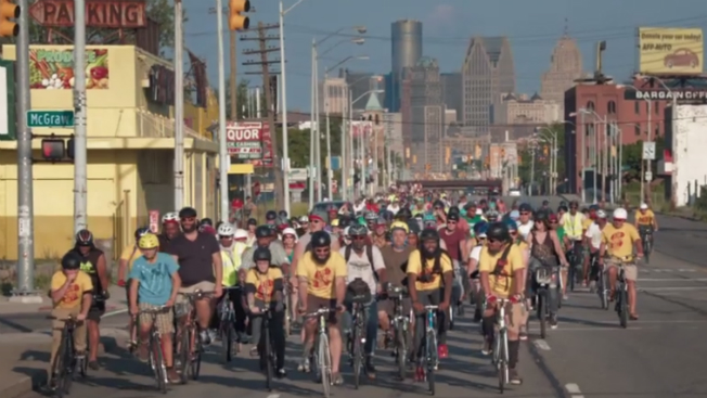 A bicycle rally rides through Detroit.